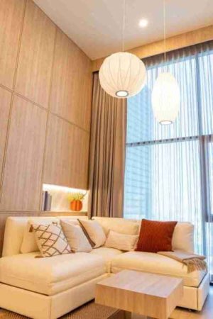 white-living-room-with-sofa-window-of-condominium-2023-11-27-05-34-36-utc